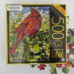 Stained glass illustration of brilliant red cardinal bird