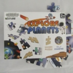Cover with planets and puzzle pieces, rocket ship