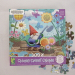 Happy gnome at one with flowers and garden