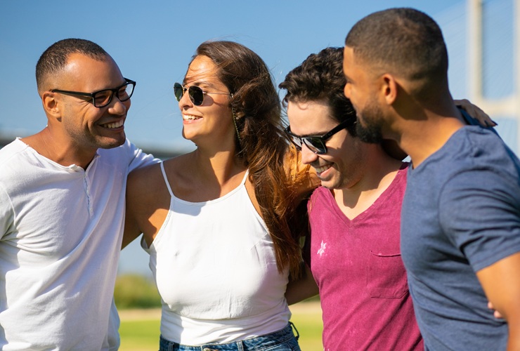 A group of friends with arms entwined.