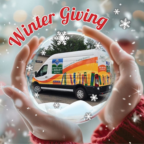 The Library District eVan sits inside a snow globe cupped in two hands