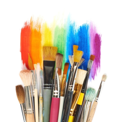 colorful paint and paintbrushes