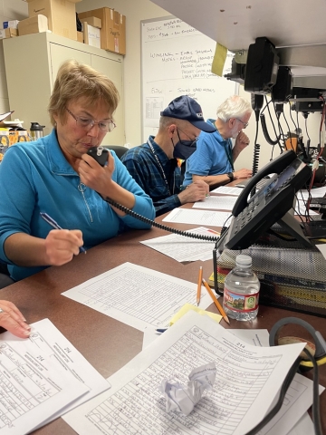People communicating with shortwave radio during an emergency.
