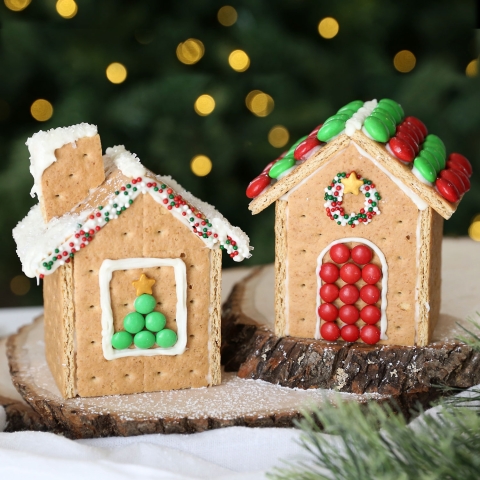 Two graham cracker gingerbread houses.