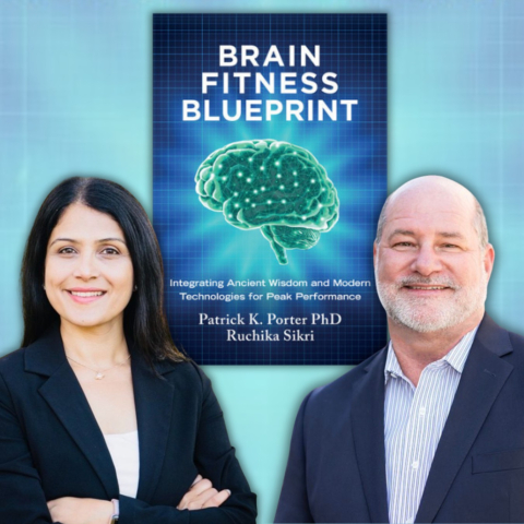 A man and a woman standing in front of a blue background with a book behind them titled Brain Fitness Blueprint: Integrating Ancient Wisdom and Modern Technologies for Peak Performance by Patrick K. Porter and Ruchika Sikri