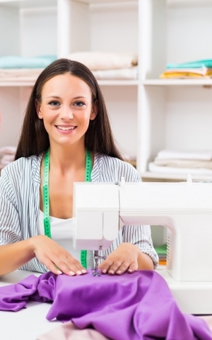 Woman using a sewing machine.