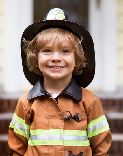 Cute kid in fireman uniform
