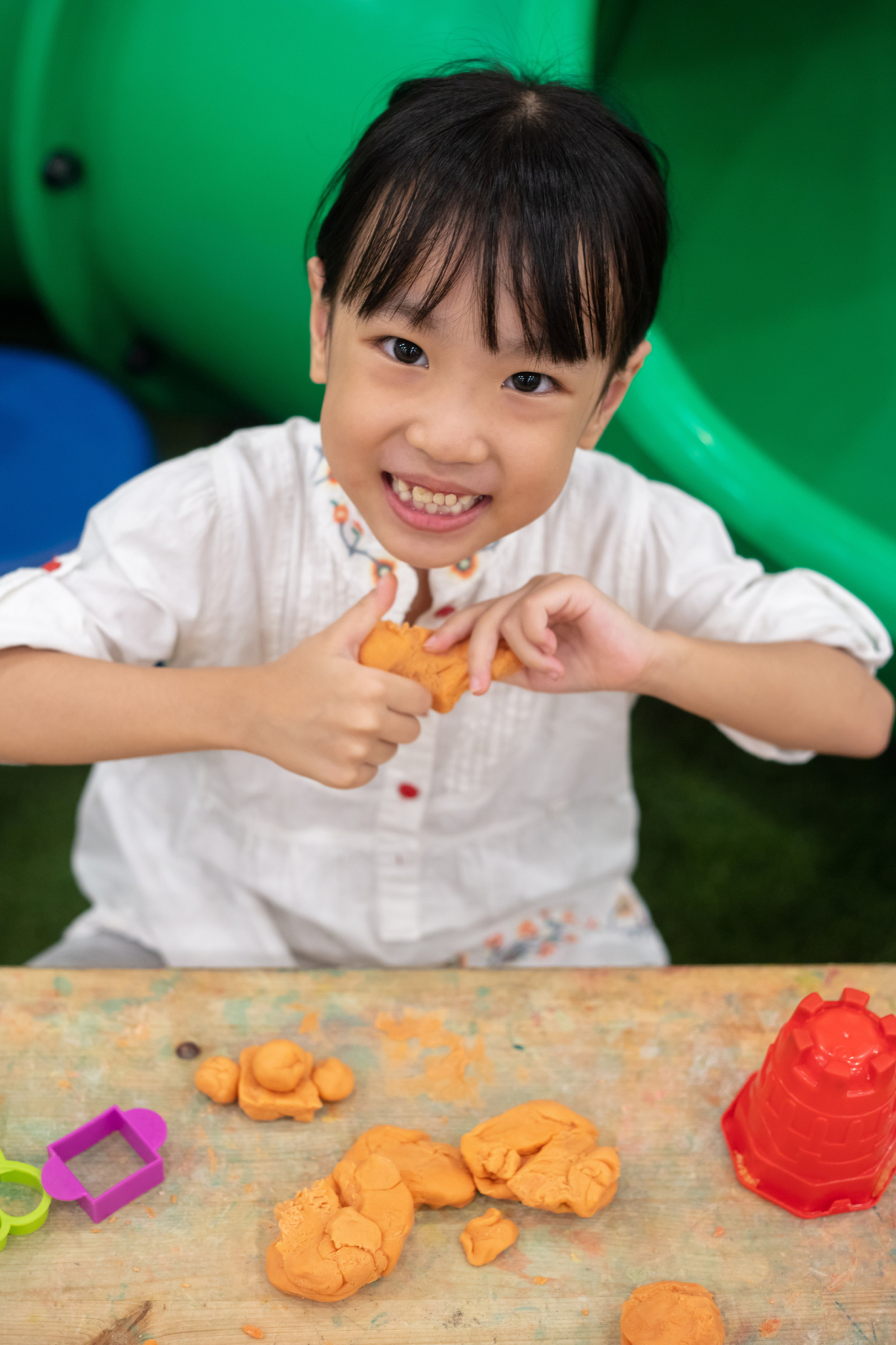 Girl Playing Colorful Clay in Indoor Playground