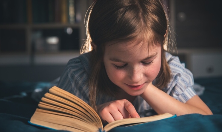 Young Girl Reading a Book
