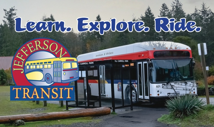 A transit bus at a bus stop.